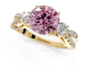 3 Stone Engagement Ring Setting for Fancy Pink Round Cut Center with Pave Split Shank and Prong Head in Yellow Gold