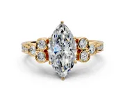 Cluster Engagement Ring Setting for Marquise Center with Bezel Accent Clusters and Prong Head in Yellow Gold