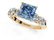 5 Stone Engagement Ring Setting for Fancy Blue Princess Cut Center with Graduated Accents and Prong Head in Yellow Gold