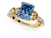 Leaf Motif Engagement Ring Setting for Fancy Blue Radiant Cut Center with Pave Band and Prong Head in Yellow Gold
