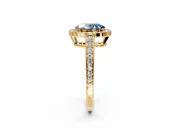 Bezel-Framed Halo Engagement Ring Setting for Fancy Blue Oval Center with Pave Band and Prong Head in Yellow Gold