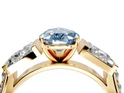 Channel-Set Engagement Ring Setting for Fancy Blue Pear-Shaped Center with Baguette Band and Prong Head in Yellow Gold