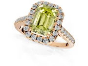 Halo Engagement Ring Setting for Fancy Yellow Emerald Cut Center with Narrowing Pave Band and Prong Head in Rose Gold