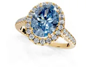 Halo Engagement Ring Setting for Fancy Blue Oval Center with Narrowing Pave Band and Prong Head in Yellow Gold