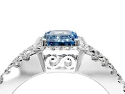 Halo Engagement Ring Setting for Fancy Blue Emerald Cut Center with Wide-Open Pave Split Shank and Prong Head in Platinum
