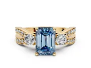3 Stone Engagement Ring Setting for Fancy Blue Emerald Cut Center with Pave Twist Band and Prong Head in Yellow Gold