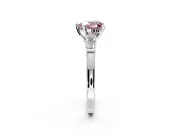 3 Stone Engagement Ring Setting for Fancy Pink Heart-Shaped Center with Channel Baguette Accents and Prong Head in Platinum