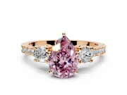 3 Stone Engagement Ring Setting for Fancy Pink Pear-Shaped Center with Round Cut Side Accents and Prong Head in Rose Gold