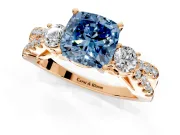 3 Stone Engagement Ring Setting for Fancy Blue Cushion Cut Center with Pave Split Shank and Prong Head in Rose Gold