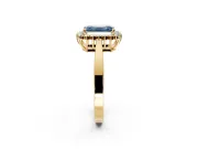 Starburst Halo Engagement Ring Setting for Fancy Blue Emerald Cut Center with Flat Cathedral Band and Prong Head in Yellow Gold