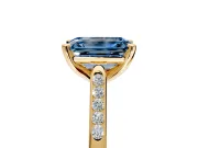 Solitaire Engagement Ring Setting for Fancy Blue Emerald Cut Center with Channel Accents and Prong Head in Yellow Gold