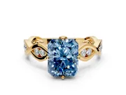 Solitaire Engagement Ring Setting for Fancy Blue Radiant Cut Center with Accented Twist Band and Leaf Prong Head in Yellow Gold