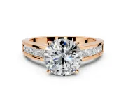 Solitaire Engagement Ring Setting for Round Cut Center with Princess Cut Channel Band and Prong Head in Rose Gold