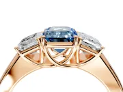 3 Stone Engagement Ring Setting for Fancy Blue Emerald Cut Center with Raised Basket Heads and Prong Head in Rose Gold