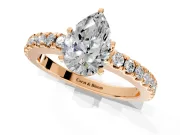 Solitaire Engagement Ring Setting for Pear-Shaped Center with Single Row Accent Band and Prong Head in Rose Gold