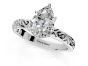 Solitaire Engagement Ring Setting for Pear-Shaped Center with Scrollwork Band and Prong Head in Platinum