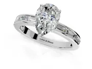 Solitaire Engagement Ring Setting for Pear-Shaped Center with Channel Baguette Band and Prong Head in Platinum
