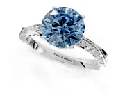 Side Accent Engagement Ring Setting for Fancy Blue Round Cut Center with Accent Shoulders and Prong Head in Platinum