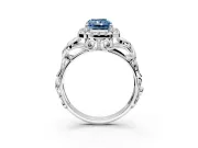 Halo Engagement Ring Setting for Fancy Blue Radiant Cut Center with Open Scroll Shoulders and Prong Head in White Gold