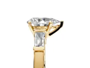 3 Stone Engagement Ring Setting for Pear-Shaped Center with Channel Baguette Accents and Prong Head in Yellow Gold