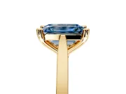 Solitaire Engagement Ring Setting for Fancy Blue Emerald Cut Center with Tapered Shoulders and Prong Head in Yellow Gold