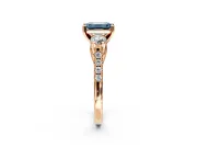 3 Stone Engagement Ring Setting for Fancy Blue Emerald Cut Center with Crossover Basket, Pave Band and Prong Head in Rose Gold