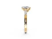 3 Stone Engagement Ring Setting for Pear-Shaped Center with Tapered Baguettes, Plain Band and Prong Head in Yellow Gold