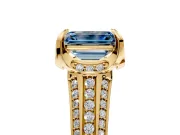Solitaire Engagement Ring Setting for Fancy Blue Emerald Cut Center with Accented Split Shank and Prong Head in Yellow Gold