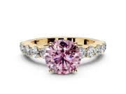 Shared-Prong Engagement Ring Setting for Fancy Pink Round Cut Center with Graduated Accents and Prong Head in Yellow Gold