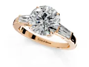 3 Stone Engagement Ring Setting for Round Cut Center with Baguette Accents and Prong Head in Rose Gold