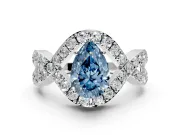 Halo Engagement Ring Setting for Fancy Blue Pear-Shaped Center with Pave Infinity Twist Band and Prong Head in White Gold
