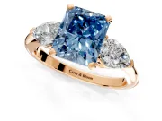 3 Stone Engagement Ring Setting for Fancy Blue Radiant Cut Center with Large Pear-Shaped Accents and Prong Head in Rose Gold