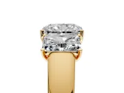 3 Stone Engagement Ring Setting for Radiant Cut Center with Raised Basket Heads and Prong Head in Yellow Gold