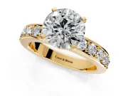 Solitaire Engagement Ring Setting for Round Cut Center with Channel-Set Accents and Prong Head in Yellow Gold