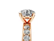 Solitaire Engagement Ring Setting for Round Cut Center with Channel-Set Accents and Prong Head in Rose Gold