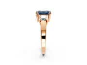 3 Stone Engagement Ring Setting for Fancy Blue Emerald Cut Center with Matching Side Accents and Prong Head in Rose Gold