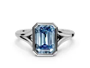 Solitaire Engagement Ring Setting for Fancy Blue Emerald Cut Center with V Split Shank and Bezel Head in Platinum