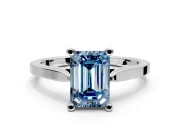 Solitaire Engagement Ring Setting for Fancy Blue Emerald Cut Center with Tapered Shoulders and Prong Head in Sterling Silver