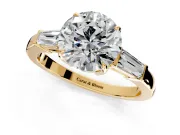 3 Stone Engagement Ring Setting for Round Cut Center with Baguette Accents and Prong Head in Yellow Gold