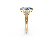 Cluster Engagement Ring Setting for Fancy Blue Marquise Center with Round Cut Accent Frame and Prong Head in Yellow Gold