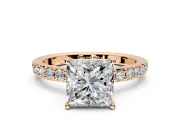 Solitaire Engagement Ring Setting for Princess Cut Center with Round Cut Pave Band and Prong Head in Rose Gold