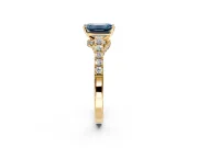 Solitaire Engagement Ring Setting for Fancy Blue Emerald Cut Center with Crossover Accents and Prong Head in Yellow Gold