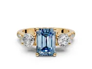 3 Stone Engagement Ring Setting for Fancy Blue Emerald Cut Center with Crossover Basket, Pave Band and Prong Head in Yellow Gold