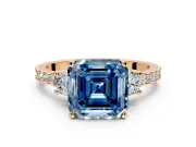 3 Stone Engagement Ring Setting for Fancy Blue Asscher Cut Center with Round Cut Side Accents and Prong Head in Rose Gold