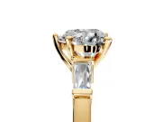 3 Stone Engagement Ring Setting for Heart-Shaped Center with Channel Baguette Accents and Prong Head in Yellow Gold