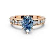 Solitaire Engagement Ring Setting for Fancy Blue Pear-Shaped Center with Channel-Set Accents and Prong Head in Rose Gold