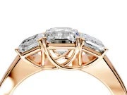 3 Stone Engagement Ring Setting for Emerald Cut Center with Raised Basket Heads and Prong Head in Rose Gold