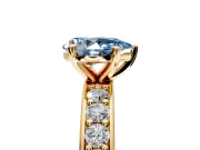Solitaire Engagement Ring Setting for Fancy Blue Pear-Shaped Center with Channel-Set Accents and Prong Head in Yellow Gold