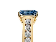 Solitaire Engagement Ring Setting for Fancy Blue Emerald Cut Center with Round Cut Channel Band and Prong Head in Yellow Gold