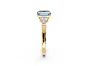 3 Stone Engagement Ring Setting for Fancy Blue Asscher Cut Center with Baguette Accents and Prong Head in Yellow Gold